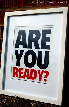 a framed poster with the words are you ready? in red, black and white