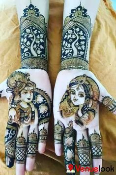 two hands with henna designs on them