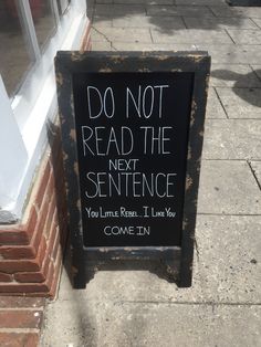 a sign on the sidewalk that reads do not read the next sentence you'll leave it later come in