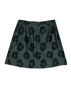 We can always count on Tory Burch to make a stand out piece for any occasion. This silk and cotton blend A-line skirt is an ideal transitional piece, pairing well with a black crop top in the summer or layering with a cardigan and tall boots come time for fall. The wrap style and button details at the waist are perfectly put together with the floral print. Size 10 Shell: 54% Silk, 46% Cotton Lining: 100% Polyester Wrap style w/ gold-toned button closures Lined A-line silhouette Dual front welt p Green Cotton Mini Skirt For Work, Fitted A-line Green Skirt, A-line Green Lined Mini Skirt, Green A-line Mini Skirt With Lining, Chic Cotton A-line Mini Skirt, Green A-line Mini Skirt For Spring, Green Cotton Pleated Mini Skirt, Flowy Green Cotton Skirt, Green Cotton Flared Mini Skirt