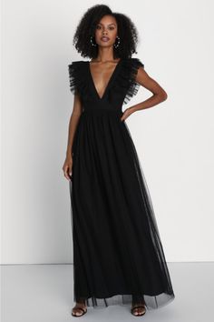 We can't wait for the perfect occasion to come around so we can stun everyone with the Lulus Simply Delighted Black Mesh Ruffled Backless Maxi Dress! This stunning dress is composed of sheer mesh fabric (atop a matching knit liner) that shapes wide straps adorned with flouncy ruffled trim, wide straps, and a sleeveless bodice with a sultry backless design. A high, banded waist tops a twirl-worthy, A-line skirt that cascades down to a sweeping maxi hem. Hidden back zipper/clasp. Fit: This garment Flirty V-neck Maxi Dress For Evening, Chic V-neck Mesh Dress For Evening, Black Tulle Dresses For Party Season, Glamorous Tulle Mesh Dress For Night Out, Black Tulle Dress For Party, Black Backless Summer Evening Dress, Chic Maxi Dress For Night Out At Gala, Formal Backless Tulle Dress, Backless Tulle Evening Dress For Party