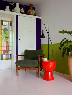 a living room filled with furniture and a potted plant