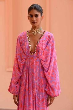 Lilac, pink kaftan with floral print and sequin embroidered neckline.
Components: 1
Pattern: Printed, Embroidery
Type Of Work: Floral
Neckline: Plunge V neck
Sleeve Type: Kaftan sleeves
Fabric: Crepe
Color: Purple,Pink
Other Details: 
Gathered waistband
Occasion: Resort - Aza Fashions Floral Print V-neck Kaftan For Party, Party Floor-length Kaftan With Floral Embroidery, Festive Anarkali Kaftan With Sequins, Anarkali Style Sequined Kaftan For Party, Bollywood Style V-neck Party Kaftan, Bollywood Style V-neck Dress With Floral Embroidery, Bollywood Style Pink V-neck Sets, Pink Bollywood V-neck Sets, V-neck Kaftan For Party And Festivals