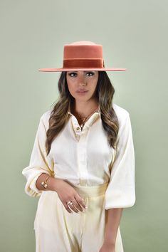 With all the flair of a classic boater hat, this handcrafted piece makes a striking presentation with a new dipped crown style. It's fashioned in smooth 100% pure Australian wool, and embellished with an elegant velvet bow. Designed with an adjustable inner band to customize and adjust to the perfect fit! Be sure to check out all our unique hat and beret styles! Details: 100% Australian wool Spot / specialist clean Style & Fit: Brim: 8.5 cm Head circumference: Small/Medium - 57cm, Medium/Lar Fitted Felt Hat With Flat Crown For Spring, Fitted Top Hat With Flat Crown For Spring, Fitted Boater Hat With Flat Crown For Fall, Fitted Fall Boater Hat With Flat Crown, Formal Panama Hat With Flat Crown For Spring, Formal Panama Hat With Flat Crown, Formal Flat Crown Panama Hat For Spring, Elegant Spring Top Hat With Flat Crown, Classic Flat Crown Felt Hat For Spring