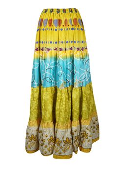 Embrace your free-spirited side with our Boho Chic Maxi Skirt, designed for the modern soul who loves to blend Green Yellow Floral comfort and style. This flowing, maxi-length skirt features vintage-inspired tribal prints and earthy tones, perfect for creating a laid-back yet hippie-style look. Handcrafted with care, the skirt boasts tiered layers and subtle, giving it a graceful, gypsy flair. Whether you're strolling on the beach or attending a festival, this relaxed-fit statement skirt will fl Green Flowy Patchwork Maxi Skirt, Multicolor Cotton Patchwork Maxi Skirt, Hippie Patchwork Multicolor Maxi Skirt, Multicolor Non-stretch Maxi Skirt For Beach, Long Floral Skirt, Non-stretch Multicolor Bohemian Maxi Skirt, Statement Skirt, Boho Skirts, Green Skirt