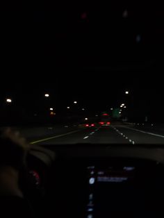 the dashboard of a car at night time