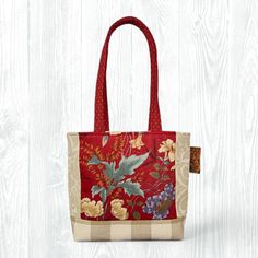 This medium, hand-sewn Beige & Red Tote Bag is perfect for carrying your items to school, work, church, shopping, or travel. It also makes a great gift! ★ Features: * One-of-a-Kind: Personally handsewn by me using carefully selected fabrics, ensuring that you'll carry a truly unique, one-of-one piece. * Convenient Design: With no zippers or snaps, this tote bag is easy to throw on and go! * Travel-Friendly: Collapsible design allows for travel and saving space. * Eco-Friendly: Made from upcycled fabrics, this tote is a sustainable choice for the environmentally conscious. * Stylish and Durable: Fully lined with coordinating fabric for added durability and a polished look. ★ Details: * Size: 9.25" height x 12" width x 4.5" deep x 25" strap length * Pockets: 2 interior pockets * Primary Colo Red Square Satchel For School, Red Square School Bag, Casual Red Square Satchel, Red Square Bag For Daily Use, Casual Burgundy Rectangular Satchel, Square Red Bag For Everyday Use, Red Bag For Daily Use, Red Satchel With Top Carry Handle For Daily Use, Red Square Satchel For Daily Use