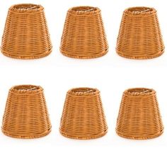 six brown wicker lampshades are lined up in the shape of a basket