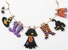 a necklace with halloween decorations hanging from it's sides and the words fifth international written in black