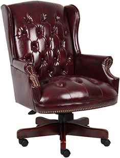 an office chair with leather upholstered and studded trimmings on the back