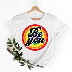 Introducing Our Pride Shirt,Be You Lgbtq Shirt,Pride Month Shirt,Gay Pride T Shirt - Available In A Wide Range Of Sizes, From S To 3xl, And A Vibrant Array Of Colors, You Can Find The Perfect Fit And Shade To Suit Your Personal Style. - Once You Place Your Order, Our Dedicated Team Will Ensure It Is Promptly Processed And Shipped To Your Doorstep. - If You Need To Make Any Changes To Your Order, Simply Let Us Know After Your Purchase, And We'll Be More Than Happy To Assist You. Pride Graphic Print Crew Neck Top, Rainbow Print Graphic Tee For Pride, Graphic Tee With Rainbow Print For Pride, Rainbow Graphic Print Tops For Pride, Rainbow Letter Print Summer Top, Rainbow Letter Print Tops For Summer, Rainbow Letter Print Top For Summer, Letter Print Tops For Pride Season Streetwear, Trendy Graphic Print Pride Tops