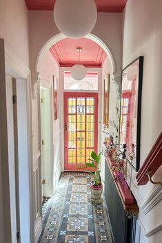 the hallway is decorated in pink and blue