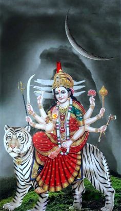 the hindu goddess sitting on top of a tiger