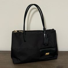 Tumi Larkin Hayes Triple Compartment Tote Bag Black With Gold Hardware Mix Of Leather And Material Very Nice, Barely Used And In Amazing Condition ~Open To Offers!~ Can Hold Many Items Including Everyday Items, And Has A Compartment For A Laptop Or Notebook, As Well As Compartments For Smaller Items Like Pens, Keys, Money, Or Makeup Total Of 5 Large Compartments Perfect For Travel, Leisure, Or Work Comes With Brand New Travel Nametag Dimensions! 16”L X 7”W X 11.5”H Black Office Bags With Gold-tone Hardware, Chic Tan Shoulder Bag With Zipper Closure, Elegant Tan Shoulder Bag For Travel, Formal Tan Bag With Zipper Closure, Elegant Black Shoulder Bag With Zipper Closure, Elegant Tan Shoulder Bag With Zipper, Chic Tan Bags For Work, Chic Tan Workwear Bags, Tumi Bags