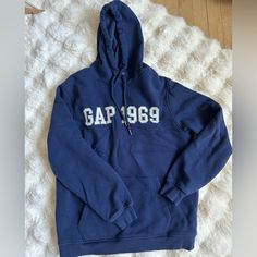 Gap Blue Hoodie- Size Small Very Cozy Inside Never Worn Or Washed Fits A Small A Little Oversized Cozy Blue Sweatshirt With Letter Print, Gap Crew Neck Winter Hoodie, Gap Crew Neck Hoodie For Winter, Gap Long Sleeve Sweatshirt With Adjustable Hood, Gap Casual Sweatshirt With Adjustable Hood, Gap Hoodie With Letter Print For Winter, Gap Winter Hoodie With Letter Print, Winter Gap Hoodie With Letter Print, Gap Long Sleeve Winter Hoodie