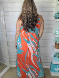 Turn heads in our Tropical Chiffon Halter Maxi Dress! With a vibrant color combination of orange and teal, this dress is perfect for any tropical getaway. The elastic drop waist ensures a comfortable yet stylish fit while the pockets add a functional element. The goddess-like flow and halter style make you feel like a true goddess. Crossed Arrows, Halter Maxi Dress, Tropical Getaways, Plus And Minus, Halter Maxi, Halter Maxi Dresses, Halter Style, New Arrival Dress, Drop Waist