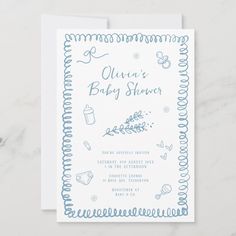 a baby shower is shown on the front of a white card with blue trimmings