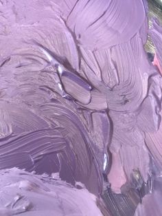 purple paint is being mixed in with the other colors