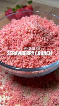 strawberry crumbs in a glass bowl on a wooden table