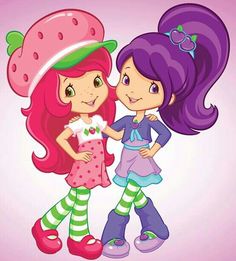 two girls are standing next to each other and one has a strawberry on her head