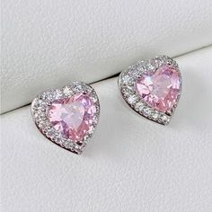 A Pair Of Heart Shaped Earrings With A Pink Center Surrounded By Small Inlaid Clear Zircon Silver Ring Set, Heart Shaped Earrings, Zirconia Earrings, Lovely Earrings, Heart Studs, Heart Earrings Studs, Pretty Jewellery, Ear Studs, Silver Diamonds