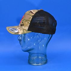 Upgrade your fashion game with the Out Of Texas 3D Embossed Emblem, meticulously placed on the iconic YP Classics® MultiCam® Retro Trucker cap. This unique blend of modern design and vintage charm elevates a simple accessory to a statement piece.The distinct camouflage patterns of MultiCam® perfectly complement the timeless retro trucker shape, creating a cap that exudes both sophistication and strength. This cap is versatile enough to match any outfit, making it a symbol of refined fashion.Embr Camouflage Curved Bill Baseball Cap, Outdoor Snapback Hat For Baseball Season With Curved Visor, Camouflage Snapback Baseball Cap For Sports, Adjustable Camouflage Snapback Hat With Visor, Camouflage Adjustable Visor Snapback Hat, Camouflage Baseball Cap With Curved Bill For Streetwear, Streetwear Camouflage Baseball Cap With Curved Bill, Urban Trucker Hat With Visor For Outdoor, Adjustable Camouflage Snapback Hat For Sports