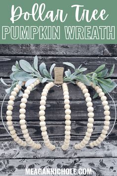 a pumpkin wreath made out of wood beads and greenery with the words, dollar tree pumpkin wreath