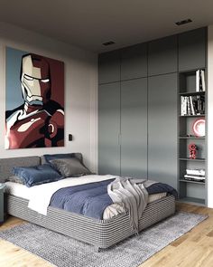 a bedroom with a bed, bookshelf and pictures on the wall