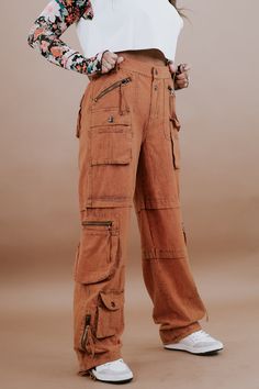 Our Mineral Washed Cargo Pants. These vintage-inspired pants offer both style and comfort. Their unique mineral-washed finish gives them an eclectic, on-trend look. Mineral Washed pants Cargo pockets Pair them with colorblock tops for a trendy, boho-inspired outfit Imported Relaxed Fit Bigger waistline Size down Fabric: 100% Cotton Measurements: S: RISE: 11" INSEAM: 32"M: RISE: 11.5" INSEAM: 32"L: RISE: 11.5" INSEAM: 32" XL: RISE: 12" INSEAM: 32" Model Specs: Karli is wearing a size small in the Vintage Baggy Cargo Jeans For Fall, Vintage Cargo Jeans For Fall, Vintage Cargo Jeans With Pockets For Spring, Vintage Baggy High Waist Cargo Pants, Baggy Vintage Cotton Cargo Jeans, Vintage Spring Cargo Pants With Cargo Pockets, Vintage Cargo Style Bottoms For Spring, Vintage Spring Cargo Style Bottoms, Vintage Cargo Style Pants For Spring