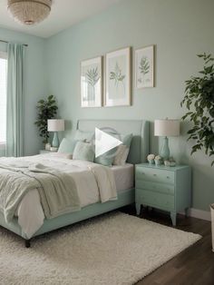 a bedroom with mint green walls and white rugs on the floor next to a bed