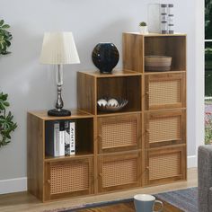 a living room with a coffee table, lamp and bookshelf