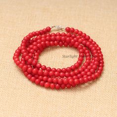 Product Description: Item Code: SGH-634 Stone Name: Red Coral  Size: 6MM Shape: Smooth Round Color: Red Length: 44 Inches (Approx.) Weight: 285Cts (Approx.) Lock: 925 Magnetic Lock  **All natural gemstones vary in color and pattern. We try our best to make our photos represent the real products in person. ** **All Customization Facility Is Available as per your Requirement Also in Other stones. ** **Bulk Order also available** **Please feel free to contact for any further queries** Hand-strung Red Round Beads, Red Coral Round Beads Single Strand, Red Coral Round Beads For Jewelry Making, Red Coral Gemstone Beads Necklace, Single Strand Red Coral Round Beads, Gift Red Coral Round Beads, Spiritual Coral Round Bead Necklaces, Single Strand Round Red Coral Beads, Single Strand Red Coral Beads