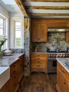 a kitchen with wooden cabinets and granite counter tops