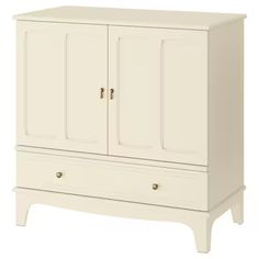 a white cabinet with two doors and drawers