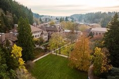 an aerial view of a large building surrounded by trees