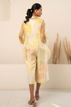 Yellow three quarter sleeve sheer jacket with contrast flower petal print. Comes with an abstract floral print jumpsuit.
Components: 2
Pattern: Print
Type Of Work: Floral
Neckline: V Neck
Sleeve Type: Jacket: Sheer Sleeves
Fabric: Organza, Chanderi
Color: Yellow
Other Details: 
Back zip closure
Occasion: Party,Resort - Aza Fashions Neck Flower, Sheer Jacket, Jumpsuit For Women, Floral Print Jumpsuit, Organza Flowers, Print Jumpsuit, Jumpsuit Online, Abstract Floral Print, Flower Petal