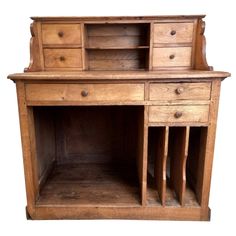 an old wooden desk with drawers and shelves