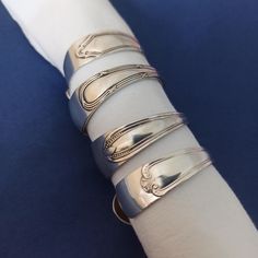 a white napkin with silver rings on it