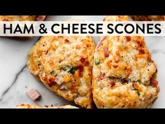 ham and cheese scones on a marble counter top with text overlay that reads ham & cheese scones