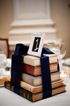 a stack of books sitting on top of a table