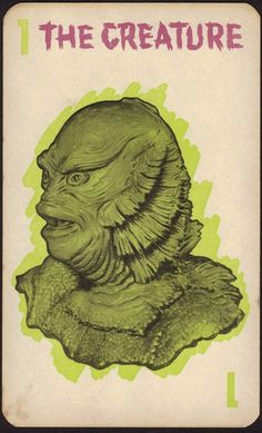 the creature card is green and black with an image of a creature's head