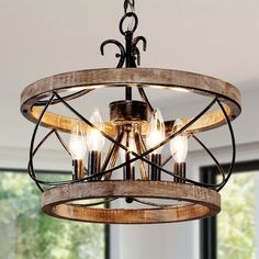 a wooden chandelier hanging from the ceiling