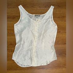 Nwt New York Studio Silk White Sleeveless Button-Down Top - Small. Brand New. Never Worn. 100% Silk. Lightweight, Soft, Silky & Luxurious. Excellent Condition. Pet Friendly And Smoke Free Home. Bundle For Best Deal. All Sales Are Final. No Returns Or Exchanges. Classic Sleeveless Blouse With Buttons, Classic Sleeveless Buttoned Blouse, Sleeveless Tops With Snap Buttons For Work, Classic Sleeveless Summer Camisole, White Buttoned Tank Top For Work, Classic Sleeveless Camisole For Summer, Classic Sleeveless Tank Top For Daywear, White Buttoned Tank Top, Classic Summer Tank Top With Buttons