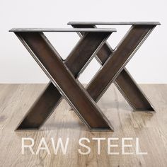 two metal x tables sitting on top of a wooden floor