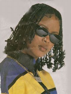 an instagramted photo of a young woman with sunglasses and dreadlocks on