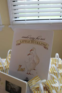 there is a little duckling book in the basket