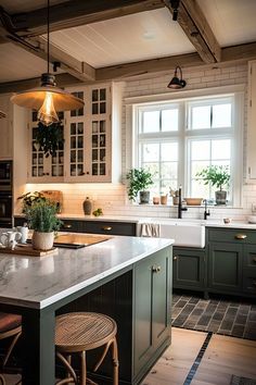 a kitchen with green cabinets and marble counter tops, along with two stools in front of the island