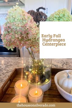 candles and flowers are on a tray with a sign that says early fall hydrangea centerpiece