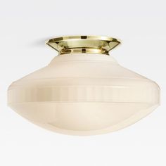 a white ceiling light with a gold trim