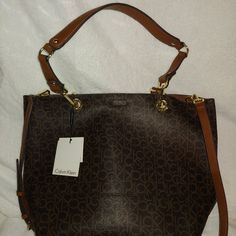 Based On The Original Price Point, I Do Not Believe This Bag Is Real Leather Or Suede, Most Likely Faux Leather On One Side And Faux Suede On The Reverse Side. I Am Unable To Find Specific Details From Calvin Klein Since This Bag Is A Few Years Old (Although It Is New). I Have Seen This Same Tote Style (Different Color) Listed On Sites As Real Leather And Suede And Other Sites List It As Faux. The Calvin Klein Reversible Tote Is The Perfect Bag To Grab Your Items And Stay Organized. With An Inte Calvin Klein Tote Bag, Calvin Klein Fragrance, Tote Bag Organizer, Tan Tote Bag, Tan Purse, Calvin Klein Bags, Calvin Klein Bag, Monogram Tote Bags, Reversible Tote